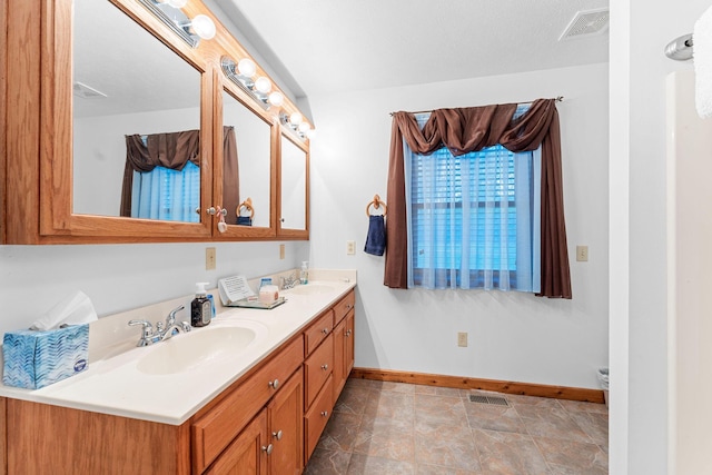 24265 Raintree Ln, Shell Knob, MO 65747 - full bath featuring baseboards, a sink, visible vents, and double vanity