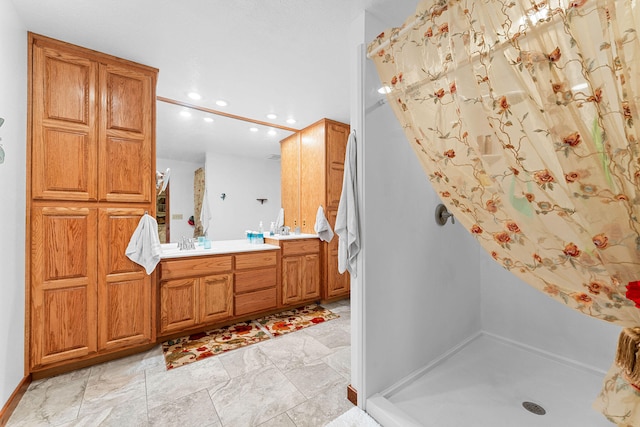 bathroom with a shower and vanity