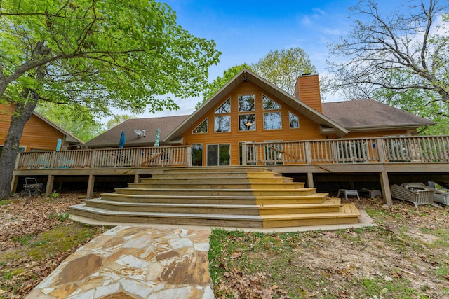 rear view of property with a deck