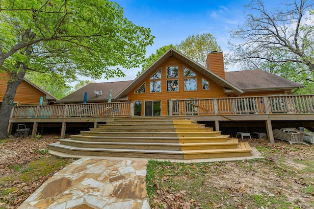 24265 Raintree Ln, Shell Knob, MO 65747 - back of property featuring a wooden deck, a chimney, and stairs