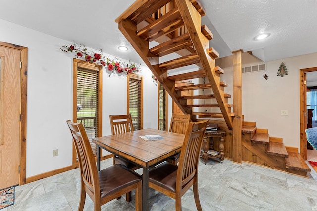 24265 Raintree Ln, Shell Knob, MO 65747 - dining area with recessed lighting, visible vents, baseboards, a textured ceiling, and stairs