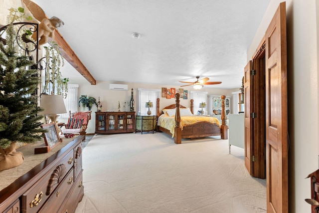 24265 Raintree Ln, Shell Knob, MO 65747 - bedroom with beamed ceiling, a wall mounted AC, and light carpet