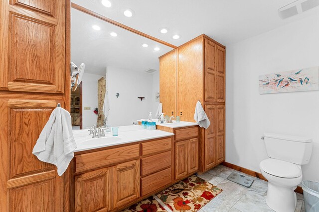 24265 Raintree Ln, Shell Knob, MO 65747 - bathroom featuring a sink, double vanity, toilet, visible vents, and recessed lighting