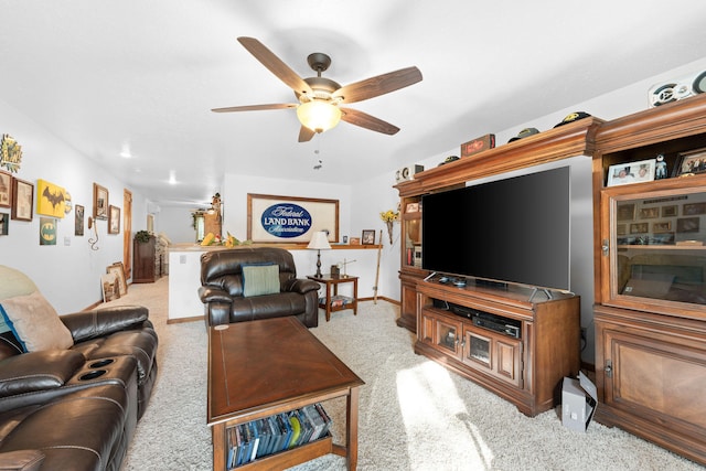 living room with light colored carpet and ceiling fan