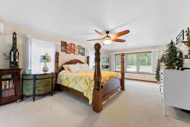 24265 Raintree Ln, Shell Knob, MO 65747 - bedroom featuring a ceiling fan, a textured ceiling, and light colored carpet