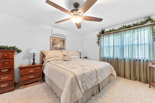 carpeted bedroom featuring ceiling fan and a wall mounted air conditioner