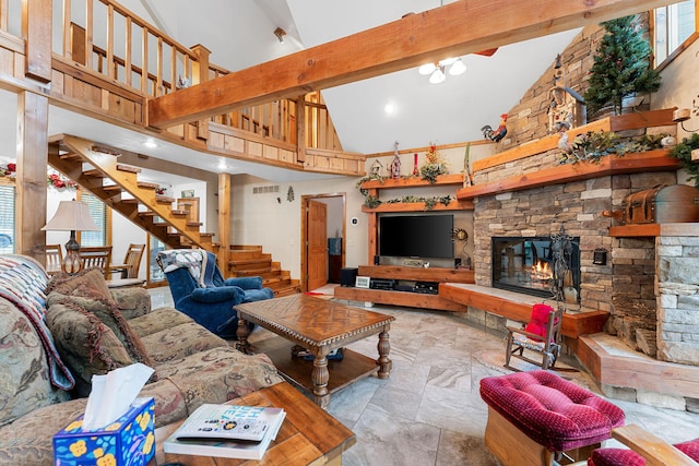 living room featuring a stone fireplace, beamed ceiling, and high vaulted ceiling