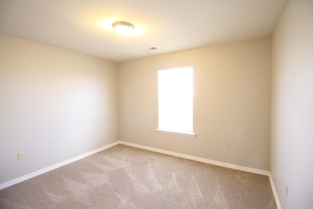 spare room with carpet floors