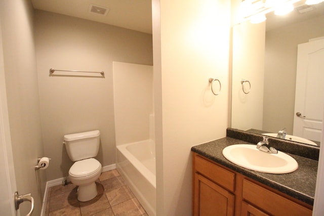 bathroom with tile patterned floors, vanity, and toilet