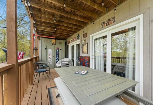 wooden deck with outdoor dining space