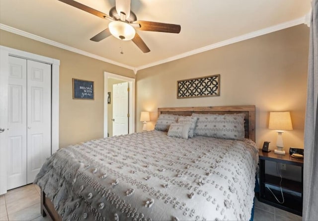 bedroom featuring a closet, crown molding, light tile patterned floors, and ceiling fan