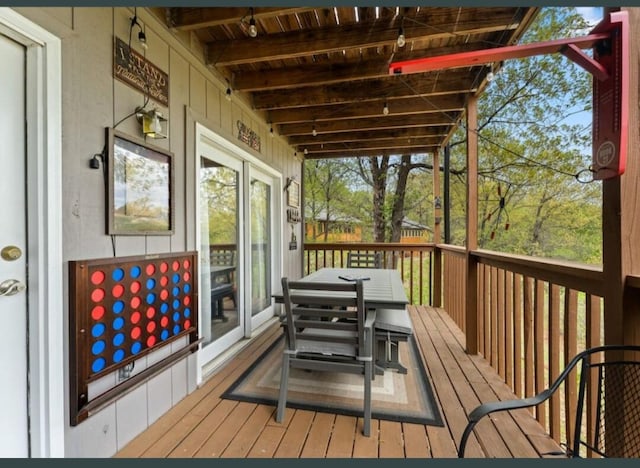 wooden deck featuring outdoor dining space