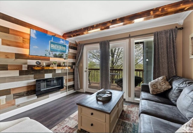 living area with crown molding, dark wood-type flooring, and beamed ceiling