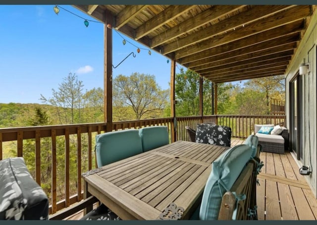 wooden deck with outdoor lounge area and outdoor dining space