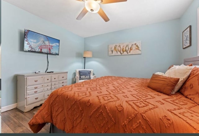 bedroom with light wood-type flooring and ceiling fan