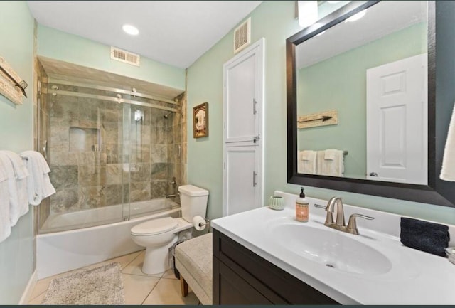bathroom featuring visible vents, tile patterned flooring, vanity, and toilet