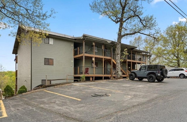 view of property featuring uncovered parking