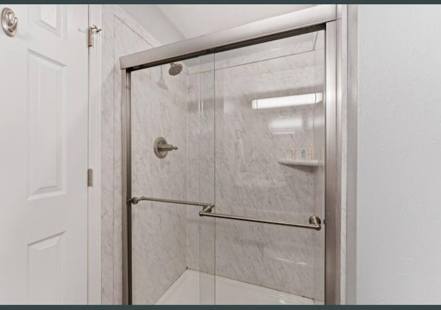 bathroom featuring a stall shower