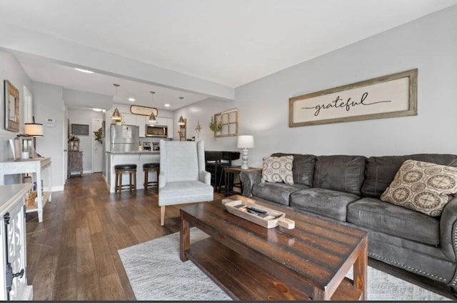 living area featuring baseboards, dark wood-style floors, and recessed lighting