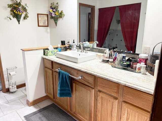 bathroom featuring tile patterned floors, vanity, and walk in shower