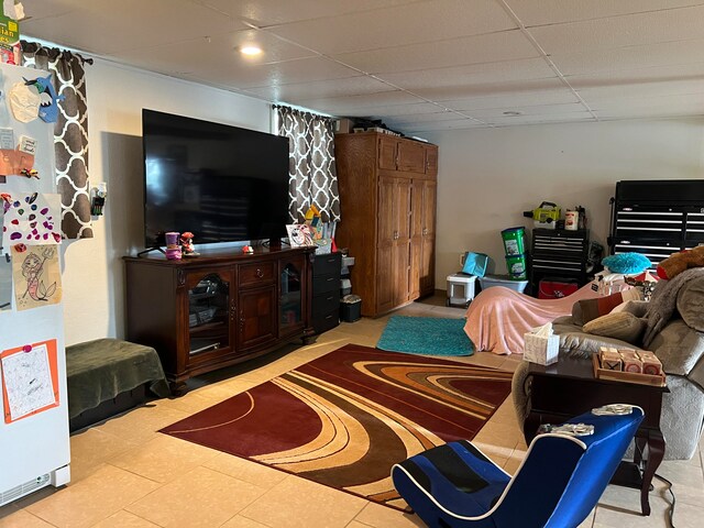 living room with a paneled ceiling