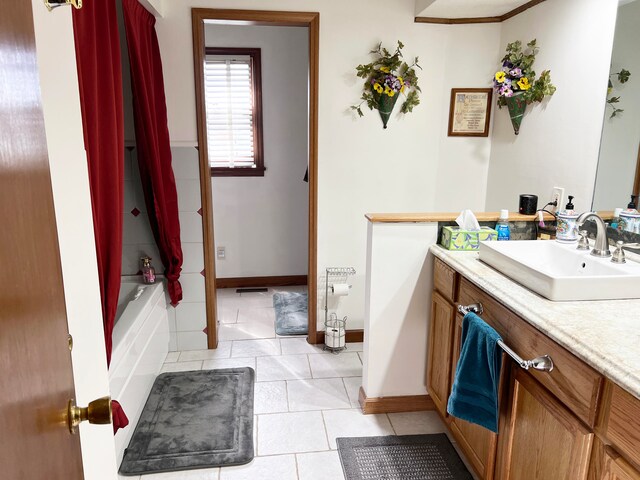 bathroom with vanity, shower / bathtub combination with curtain, and tile patterned floors