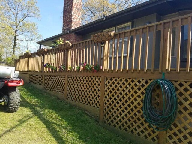 exterior space with a lawn and a wooden deck