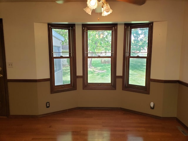 spare room with ceiling fan and light hardwood / wood-style flooring