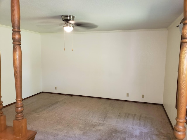 unfurnished room featuring ceiling fan, light colored carpet, and ornamental molding