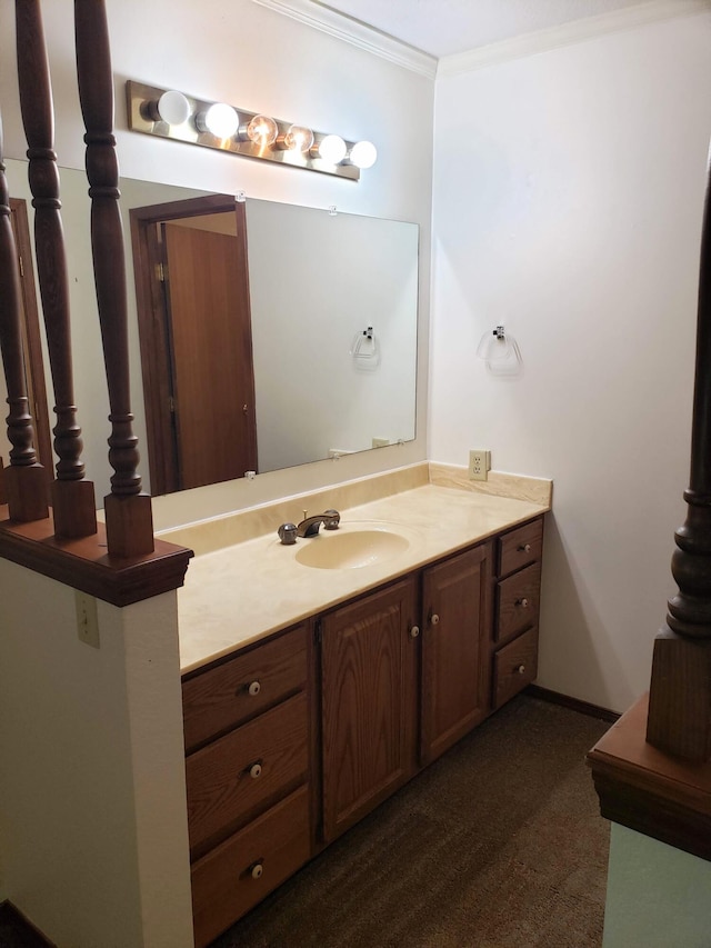 bathroom featuring vanity and ornamental molding