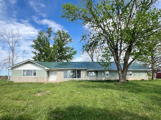 ranch-style house with a front lawn