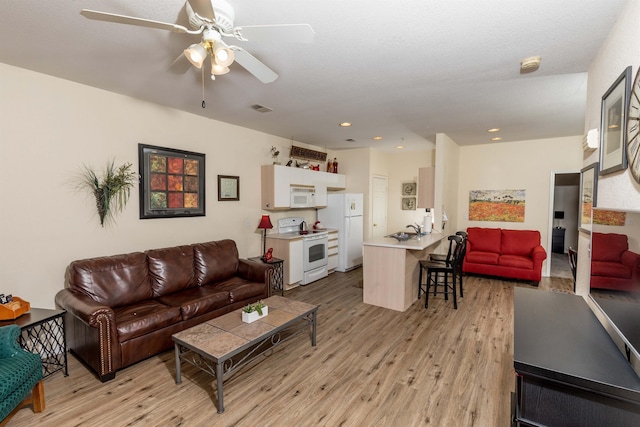 813 Holiday Rdg Unit 6, Branson, MO 65616 - living room featuring recessed lighting, a ceiling fan, visible vents, and light wood-style flooring