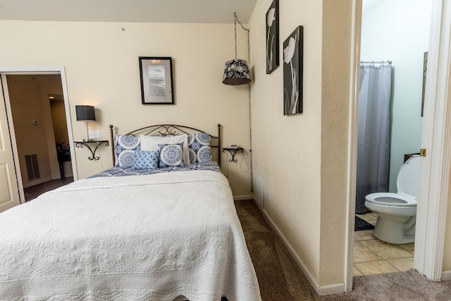 813 Holiday Rdg Unit 6, Branson, MO 65616 - carpeted bedroom with baseboards, ensuite bathroom, and visible vents