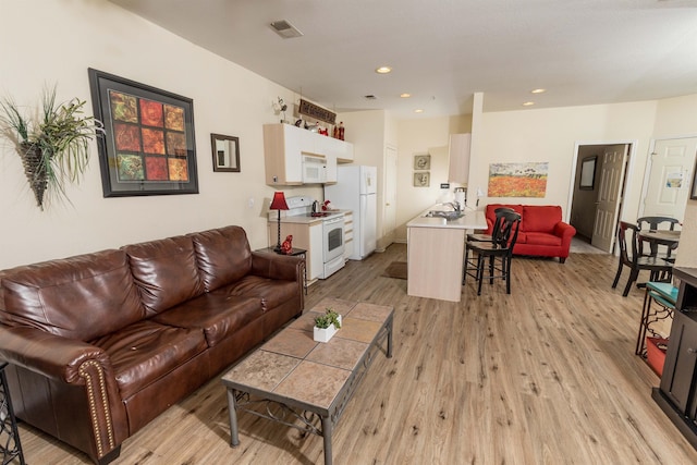 813 Holiday Rdg Unit 6, Branson, MO 65616 - living room with light wood-style floors, visible vents, and recessed lighting