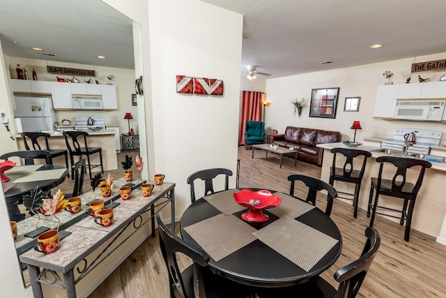 813 Holiday Rdg Unit 6, Branson, MO 65616 - dining area featuring a ceiling fan, light wood finished floors, and recessed lighting