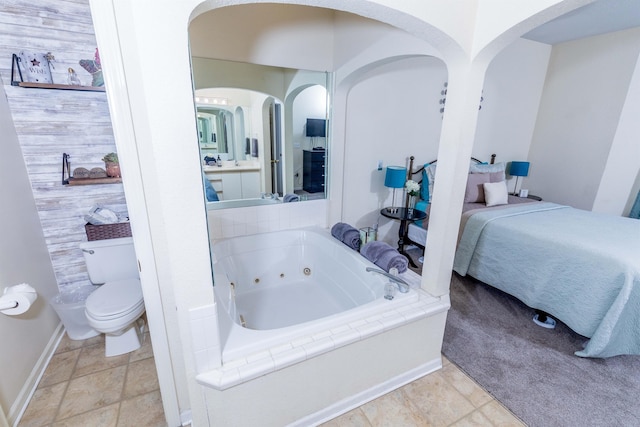 813 Holiday Rdg Unit 6, Branson, MO 65616 - full bath featuring baseboards, a whirlpool tub, and toilet