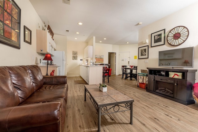 813 Holiday Rdg Unit 6, Branson, MO 65616 - living area featuring visible vents, recessed lighting, and light wood-style floors