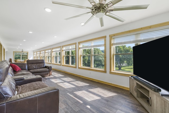 living room featuring dark hardwood / wood-style floors and ceiling fan