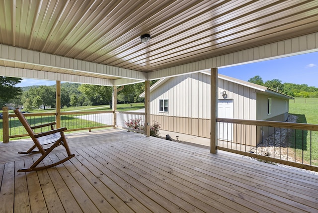 wooden deck featuring a yard