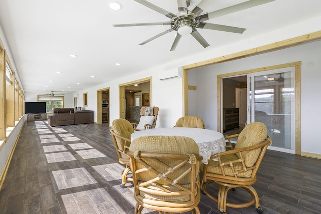 dining room with ceiling fan, dark hardwood / wood-style floors, and a wall mounted AC