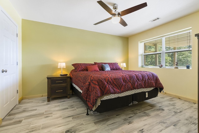 bedroom featuring ceiling fan and light hardwood / wood-style floors