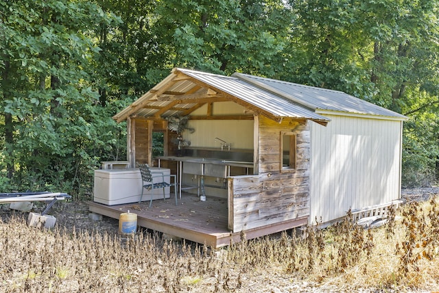 deck featuring an outdoor structure