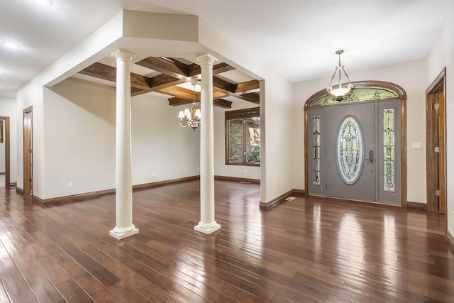 entryway with ornate columns, a notable chandelier, beamed ceiling, and dark hardwood / wood-style flooring