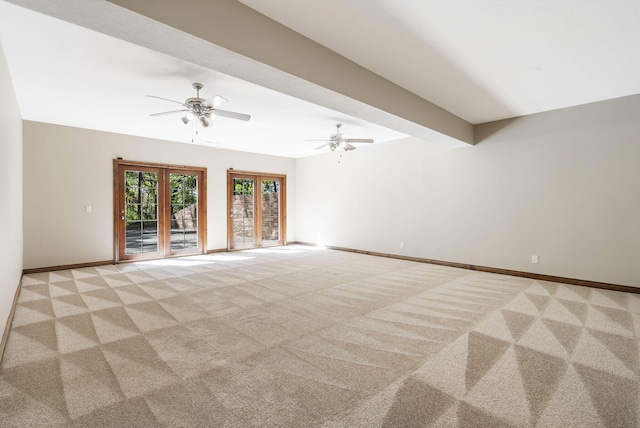 unfurnished living room featuring light carpet, beam ceiling, french doors, and ceiling fan