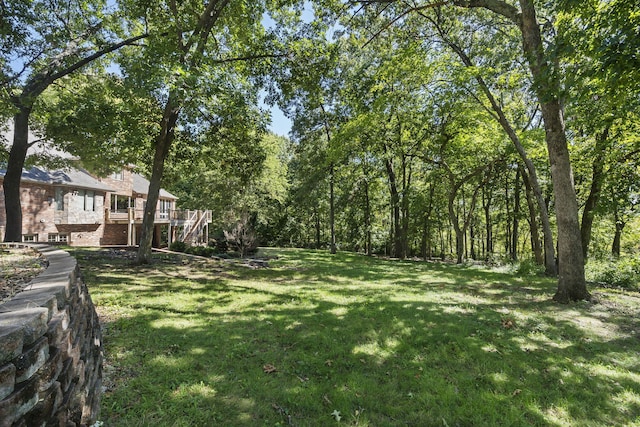 view of yard featuring a wooden deck