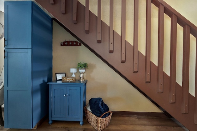 stairway featuring hardwood / wood-style flooring