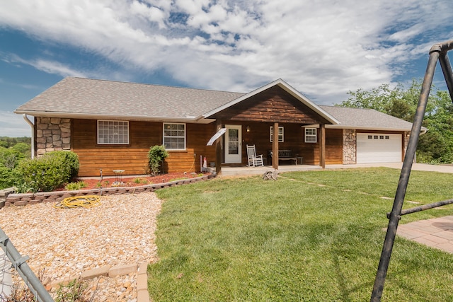 ranch-style home with a garage and a front lawn