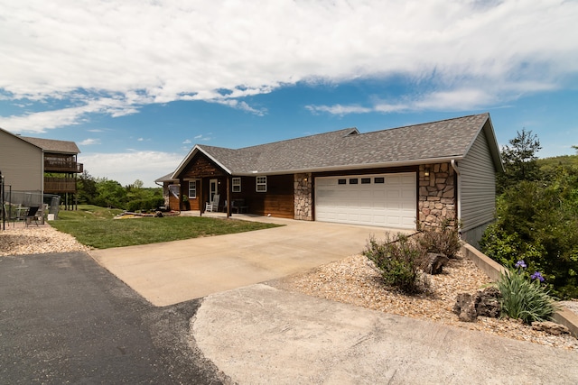 view of front of home featuring a front lawn and a garage