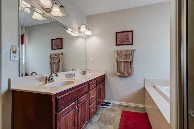 bathroom with vanity and a tub to relax in