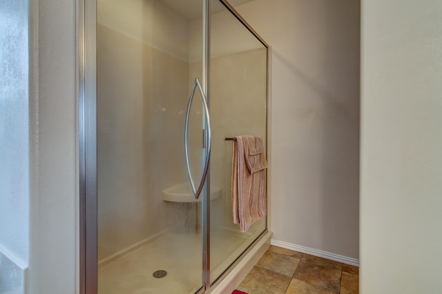 bathroom featuring an enclosed shower